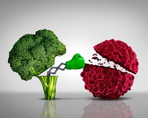 Broccoli che prendono a pugni una cellula tumorale