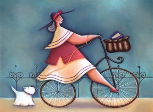 donna in bicicletta con cane al guinzaglio