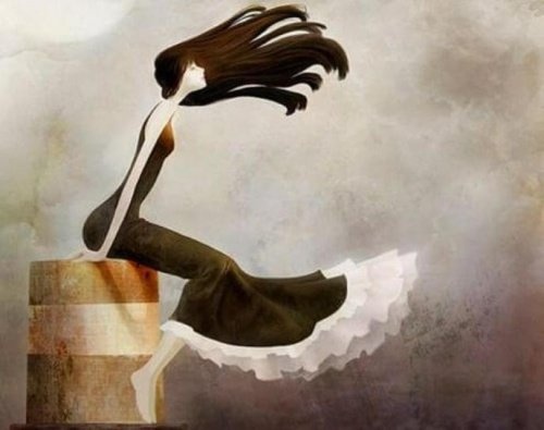 Ragazza seduta su una botte con i capelli al vento