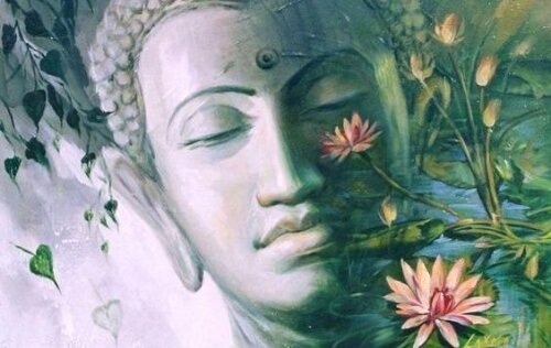 Testa di Buddha e fiori di loto a rappresentare il Buddhismo