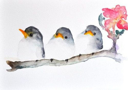 Tre uccellini su un ramo