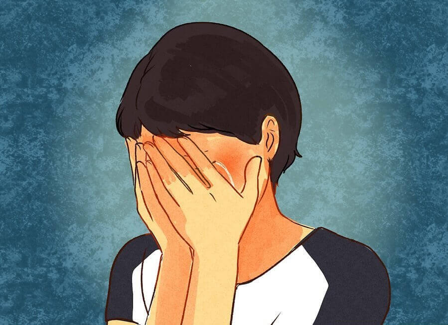 Crying woman with hands on face