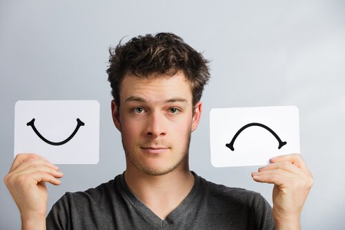 Boy with happy-sad designs
