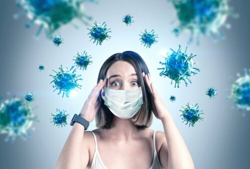 Donna con mascherina circondata da virus